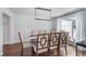 Traditional dining room with modern chandelier, decorative chairs, and large window at 333 S Fourth St, Zionsville, IN 46077