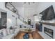 Spacious living room with high ceilings, a loft, fireplace, and access to the kitchen and outdoor area at 333 S Fourth St, Zionsville, IN 46077