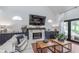 Cozy living room with a modern fireplace, white shiplap, wood accents, and comfortable seating at 333 S Fourth St, Zionsville, IN 46077