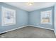 Empty bedroom with two windows and neutral colors offering a blank canvas for new owners at 3433 Brouse Ave, Indianapolis, IN 46218