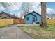 Charming blue house featuring a spacious gated driveway and a well-maintained exterior at 3433 Brouse Ave, Indianapolis, IN 46218
