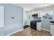 Open kitchen layout with stainless steel appliances, granite counters and natural light at 3433 Brouse Ave, Indianapolis, IN 46218