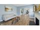 Open-concept living room with hardwood floors and view of the kitchen at 3433 Brouse Ave, Indianapolis, IN 46218