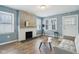 Cozy living room showcasing a charming fireplace and a bright atmosphere with natural light at 3433 Brouse Ave, Indianapolis, IN 46218