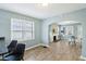 Inviting living room with fireplace and archway entrance offering lots of light and open spaces at 3433 Brouse Ave, Indianapolis, IN 46218