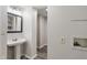 Neutrally painted bathroom featuring a pedestal sink and modern fixtures at 3703 Dubarry Rd, Indianapolis, IN 46226