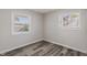 This bedroom is complete with neutral colors, window, and hard surface floors at 3703 Dubarry Rd, Indianapolis, IN 46226