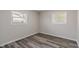 This bedroom has hard surface floors and two windows at 3703 Dubarry Rd, Indianapolis, IN 46226