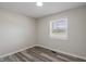 This bedroom has hard surface floors and one window at 3703 Dubarry Rd, Indianapolis, IN 46226