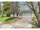 Well-kept single Gathering home with attached garage and front yard with mature trees at 3703 Dubarry Rd, Indianapolis, IN 46226