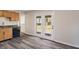 Kitchen area features stainless steel dishwasher and access to the backyard through double doors at 3703 Dubarry Rd, Indianapolis, IN 46226
