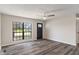 Bright room with large windows and modern floors, creating an airy and inviting living space at 3703 Dubarry Rd, Indianapolis, IN 46226