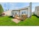 Backyard featuring a deck, a grill, green grass and the exterior of the home at 376 Lake Ridge Ln, Greenwood, IN 46142