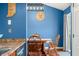 Cozy breakfast nook with warm wood table, hardwood floors, and blue accent wall at 376 Lake Ridge Ln, Greenwood, IN 46142