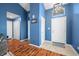 Bright foyer with tile flooring, coat closet and view to open living area at 376 Lake Ridge Ln, Greenwood, IN 46142