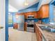 Well-lit kitchen with stainless steel appliances, updated countertops, and warm wood cabinetry at 376 Lake Ridge Ln, Greenwood, IN 46142