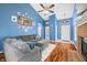 Comfortable living room with a large sectional sofa, modern ceiling fan, and stylish decor at 376 Lake Ridge Ln, Greenwood, IN 46142