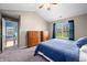 Comfortable main bedroom with warm wood furniture, ceiling fan, and natural lighting at 376 Lake Ridge Ln, Greenwood, IN 46142