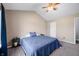 Comfortable main bedroom featuring plush carpet, ceiling fan, and neutral decor at 376 Lake Ridge Ln, Greenwood, IN 46142