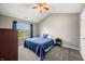 Spacious main bedroom with vaulted ceiling, ceiling fan, and large window at 376 Lake Ridge Ln, Greenwood, IN 46142