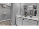Bright bathroom boasts double sink vanity with ample storage and a spacious walk in closet at 4105 Ashton View Ln, Indianapolis, IN 46268