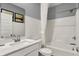 Bright bathroom features a white subway tile backsplash, clean fixtures, and a shower-tub combo for relaxation at 4105 Ashton View Ln, Indianapolis, IN 46268