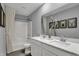 Bathroom featuring a double sink vanity and shower over tub, complemented by stylish decor at 4105 Ashton View Ln, Indianapolis, IN 46268