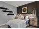 Modern bedroom showcases unique wall decor, complementing the neutral color scheme and creating a sophisticated atmosphere at 4105 Ashton View Ln, Indianapolis, IN 46268