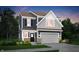 Charming two-story home with attached garage, and professionally landscaped front yard at 4105 Ashton View Ln, Indianapolis, IN 46268