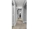 Hallway view with multiple doorways, leading to various rooms in the house at 4105 Ashton View Ln, Indianapolis, IN 46268