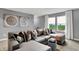 Inviting living room with a comfortable sectional sofa, natural light, and views of the green landscape at 4105 Ashton View Ln, Indianapolis, IN 46268