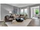 Comfortable living area featuring a large sofa, stylish decor, and natural light at 4105 Ashton View Ln, Indianapolis, IN 46268