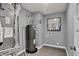 Small utility room with hot water heater, furnace, gray walls, and white baseboards at 4105 Ashton View Ln, Indianapolis, IN 46268