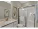 Modern bathroom featuring a shower with glass doors, vanity with quartz countertop and decorative artwork at 4330 Persian St, Greenwood, IN 46143