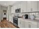 Modern kitchen with white cabinets, stainless steel appliances, and stylish backsplash at 4330 Persian St, Greenwood, IN 46143