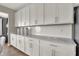Close-up on kitchen's white cabinets, modern fixtures, and countertop at 4330 Persian St, Greenwood, IN 46143