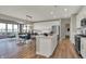 Open-concept kitchen with an island, stainless steel appliances, and an adjacent dining area at 4330 Persian St, Greenwood, IN 46143