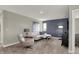 Cozy living room with plush carpet, stylish furnishings, neutral color scheme, and well lit with natural light at 4330 Persian St, Greenwood, IN 46143
