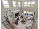 Spacious living room with high ceilings, large windows, comfortable seating, and a cozy fireplace at 4330 Persian St, Greenwood, IN 46143