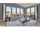 Inviting living room featuring large windows with a cozy couch and coffee table; plush rug and neutral color palette at 4330 Persian St, Greenwood, IN 46143