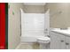 Bathroom featuring a shower-tub combo, toilet, and vanity at 4505 Phoenix Dr, Indianapolis, IN 46241