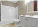Bathroom featuring a shower-tub combo, toilet, and vanity at 4505 Phoenix Dr, Indianapolis, IN 46241
