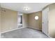 A bedroom featuring tan walls, carpet, and a door at 4505 Phoenix Dr, Indianapolis, IN 46241
