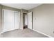 Neutral bedroom with white closet doors and views to another room at 4505 Phoenix Dr, Indianapolis, IN 46241