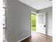 Bright entryway featuring gray walls and hardwood flooring with a clear view to the front yard at 4505 Phoenix Dr, Indianapolis, IN 46241