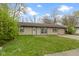 Charming single story home with well-manicured lawn at 4505 Phoenix Dr, Indianapolis, IN 46241