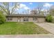 Charming single-story home featuring a spacious front yard and private driveway at 4505 Phoenix Dr, Indianapolis, IN 46241