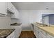 A kitchen featuring white cabinets and drawers, and a stainless steel sink with faucet at 4505 Phoenix Dr, Indianapolis, IN 46241