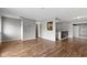 Open-concept living room featuring gray walls and hardwood flooring, ideal for hosting guests at 4505 Phoenix Dr, Indianapolis, IN 46241