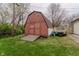 A red barn with a ramp leading to double doors, providing convenient access to outdoor storage at 5510 Chelsea Rd, Indianapolis, IN 46241
